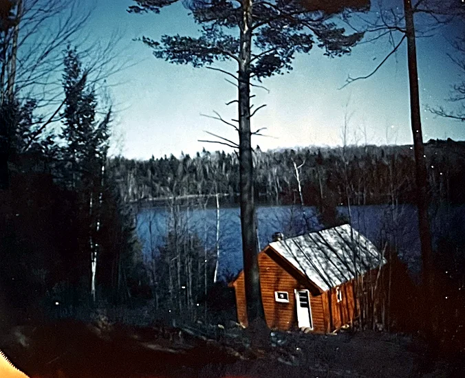 The Lodge when it was still young, right after the road was built. The first materials came across the lake by canoe — that proved much too…